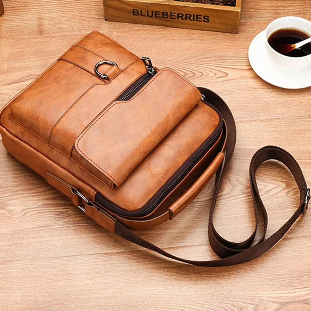 Vintage Explorer crossbody bag showing spacious interior compartments and smooth PU leather exterior finish