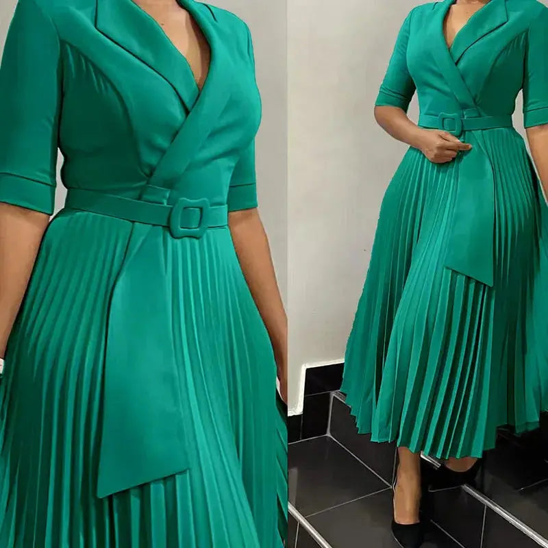 Black pleated dress with tailored elegance and suit collar, perfect for professional women.