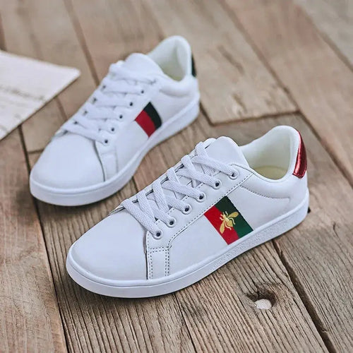 Black urban flat sneakers with gold bee embroidery detail on side panel