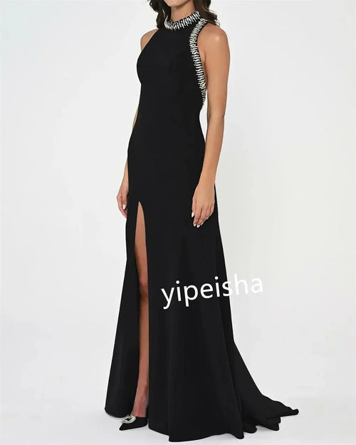 Side view of the Captivate the Night gown showcasing its tailored fit and floor-length silhouette.