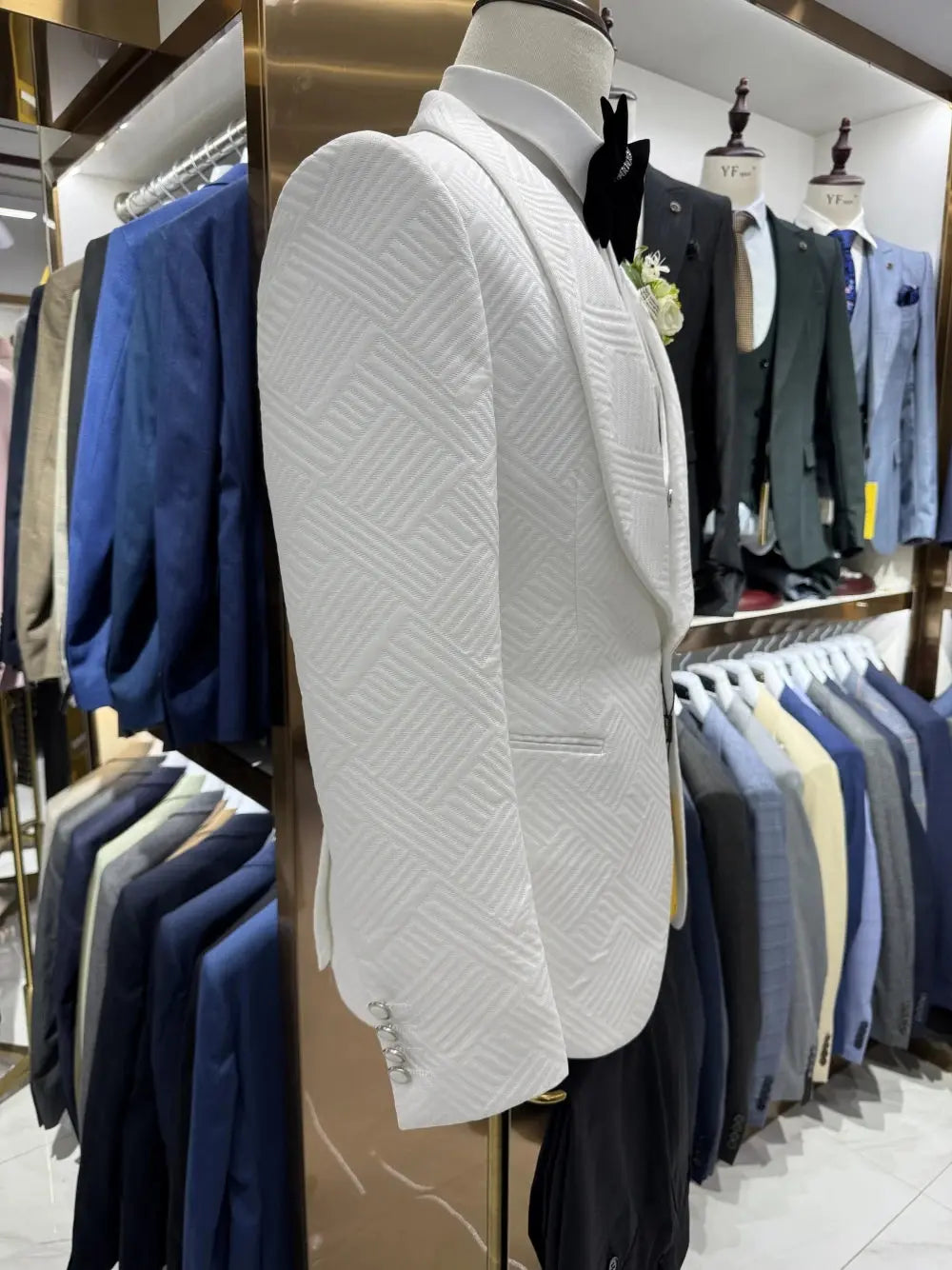 Vintage-inspired vest from the white jacquard suit, showcasing intricate detailing.