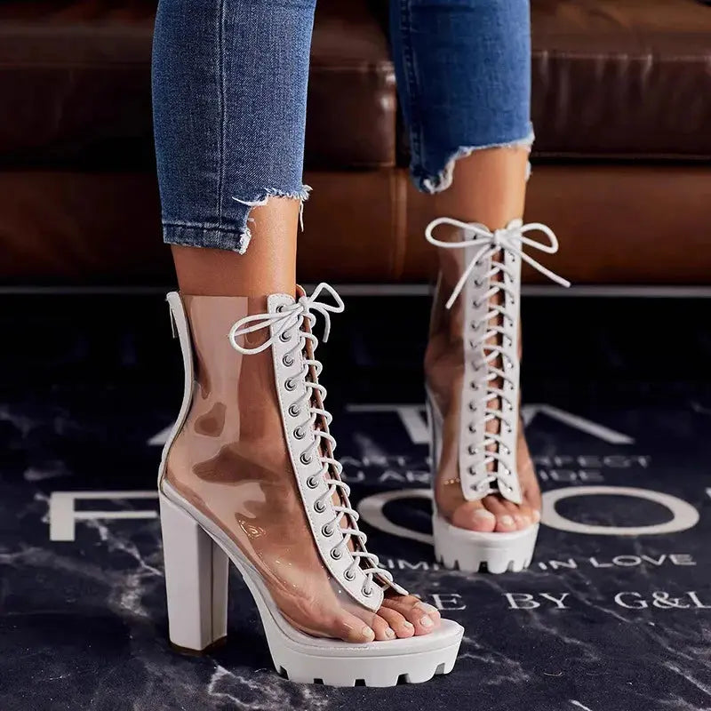 Stylish peep toe design on transparent sandals for bold fashion statements.