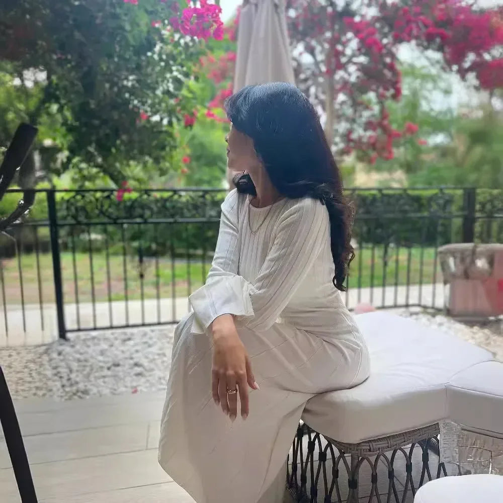 Elegant white maxi dress featuring high-stretch fabric for comfort and style.