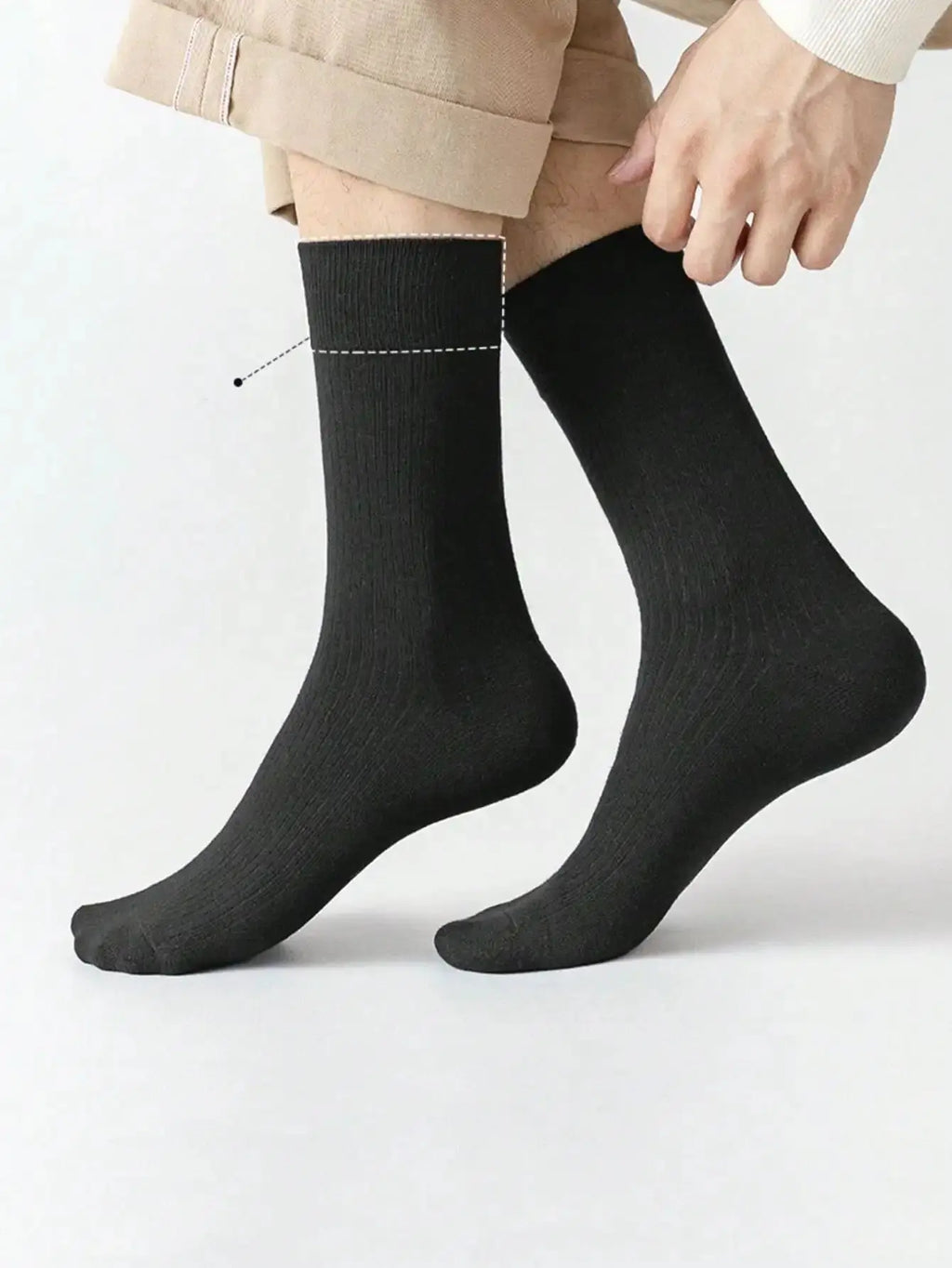 Stylish gray dress socks designed for a snug fit, perfect for business attire.