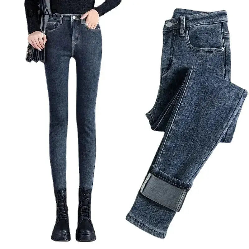 Model wearing high-waisted jeans, highlighting their flattering silhouette.