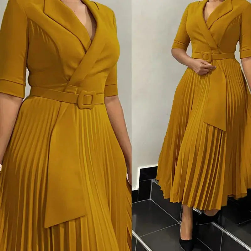A-line pleats of the dress flowing gracefully, highlighting comfort and movement.