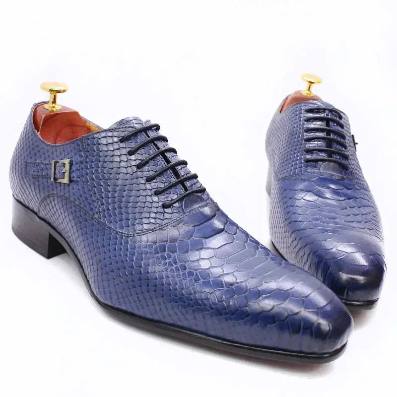 Close-up of pointed toe oxfords showcasing genuine cow leather texture.