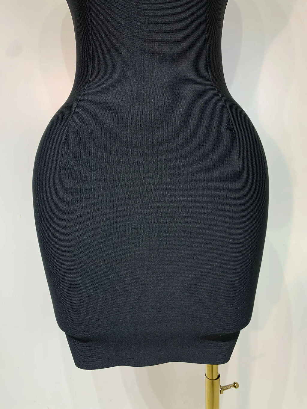 Flat lay of the elegant evening dress, emphasizing its luxurious fabric and trendy style.