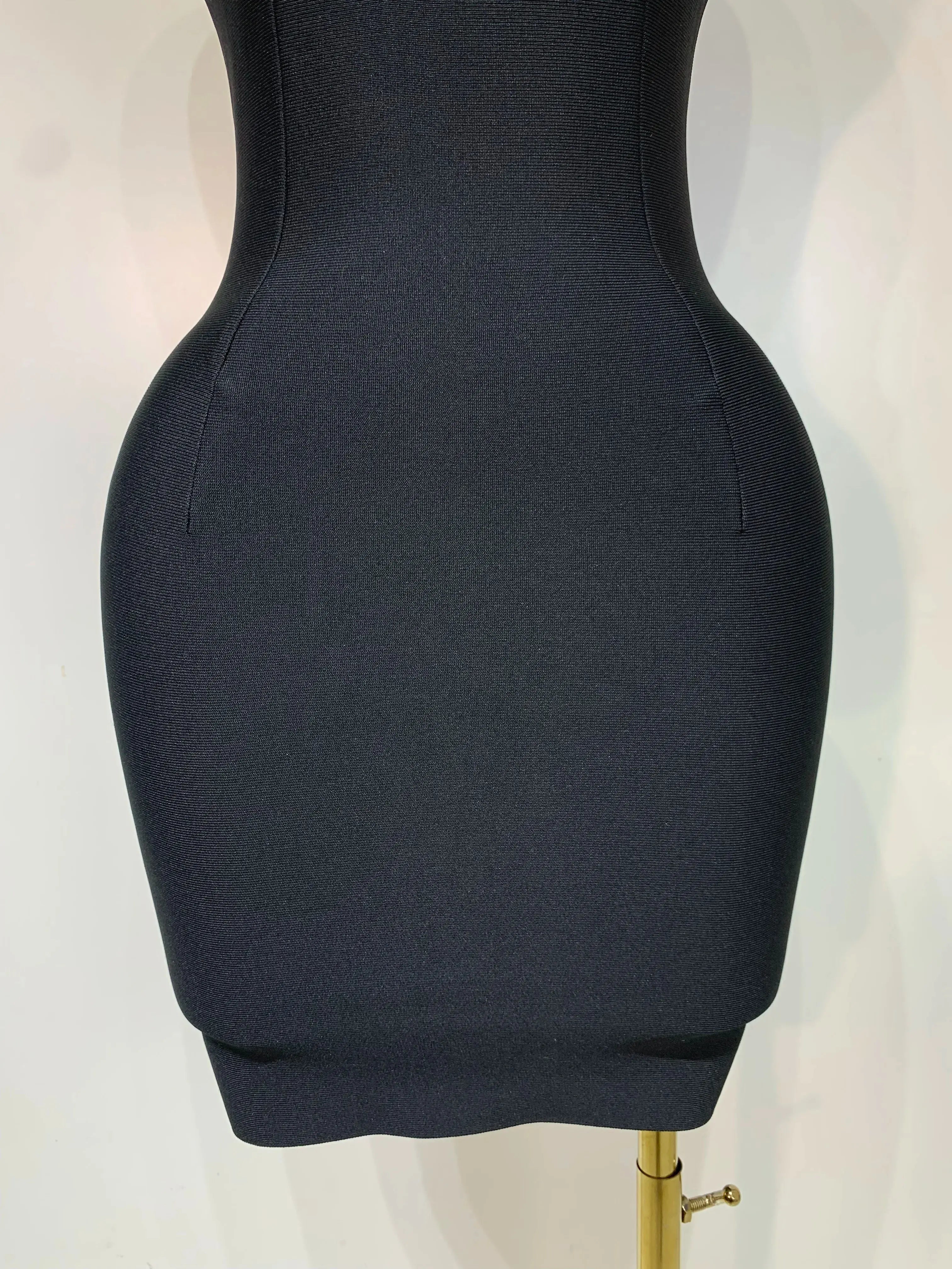 Flat lay of the elegant evening dress, emphasizing its luxurious fabric and trendy style.