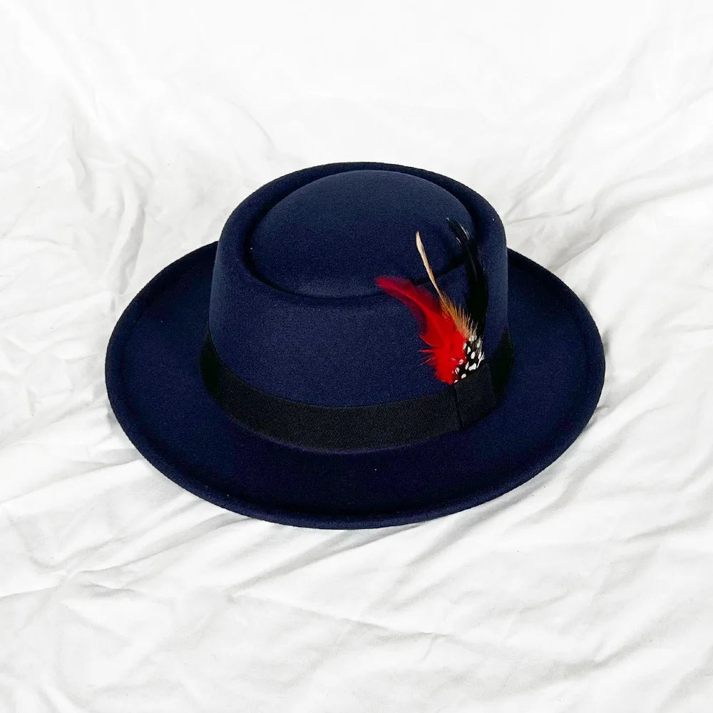 Black fedora with feather detail, perfect for performance attire or special occasions.