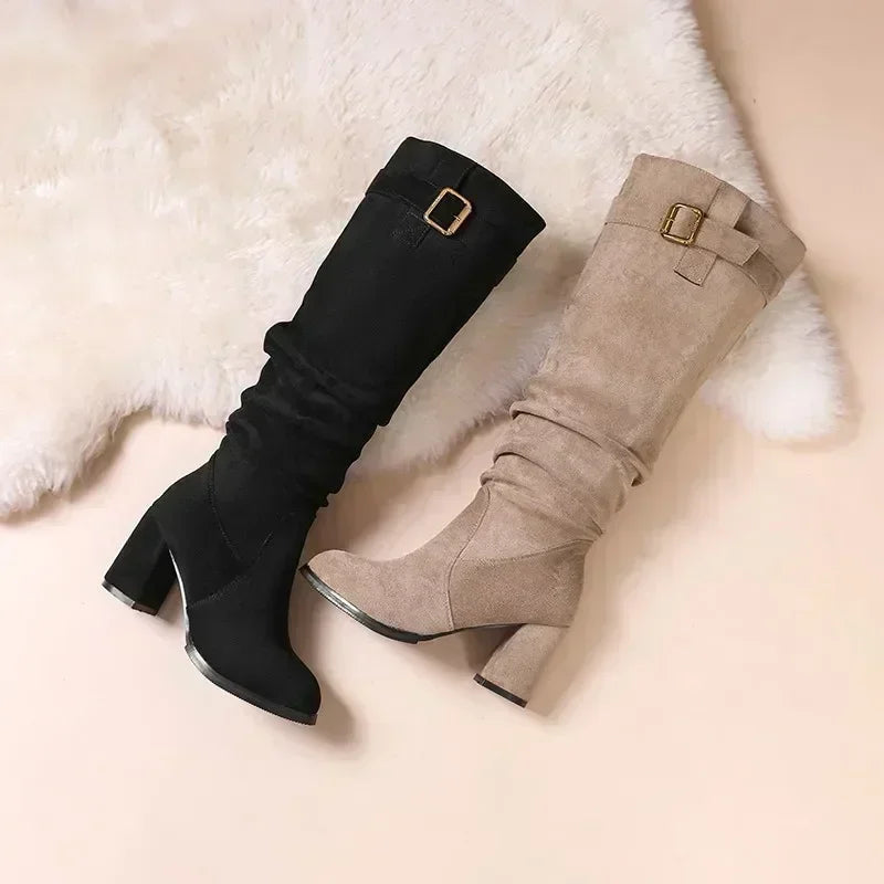 Women's slip-on mid-calf boots featuring waterproof suede construction and stable square heel