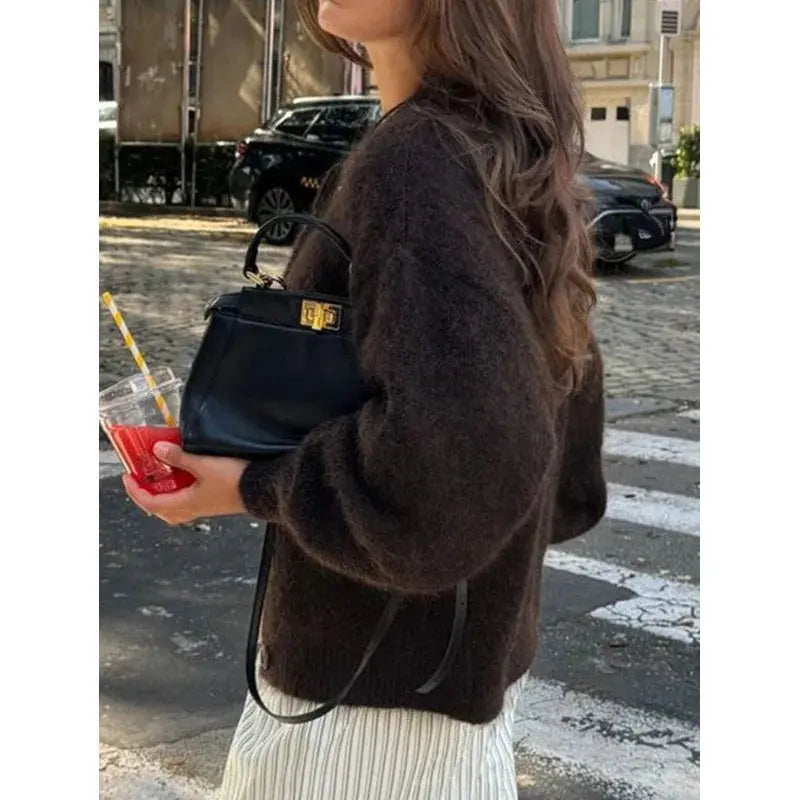 Relaxed fit cardigan featuring soft knit fabric, ideal for cold weather and casual outings.