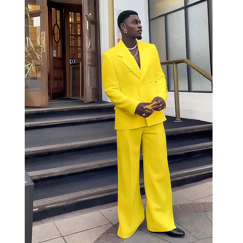 Model adjusting the white suit jacket, demonstrating its fit.