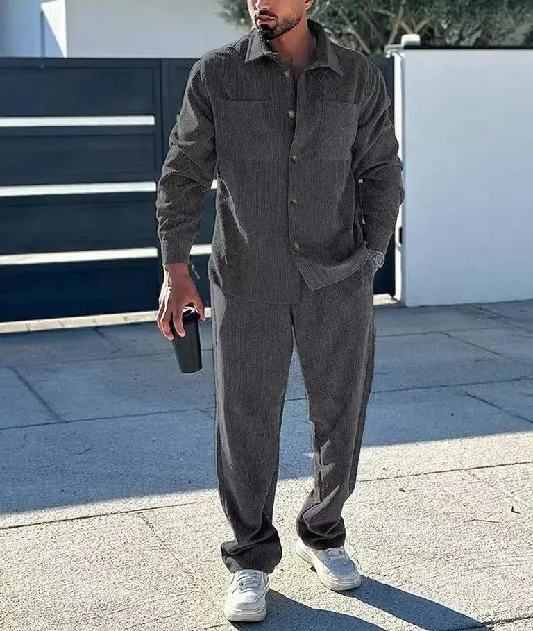 Casual gathering scene with a man confidently wearing the men's leisure suit.