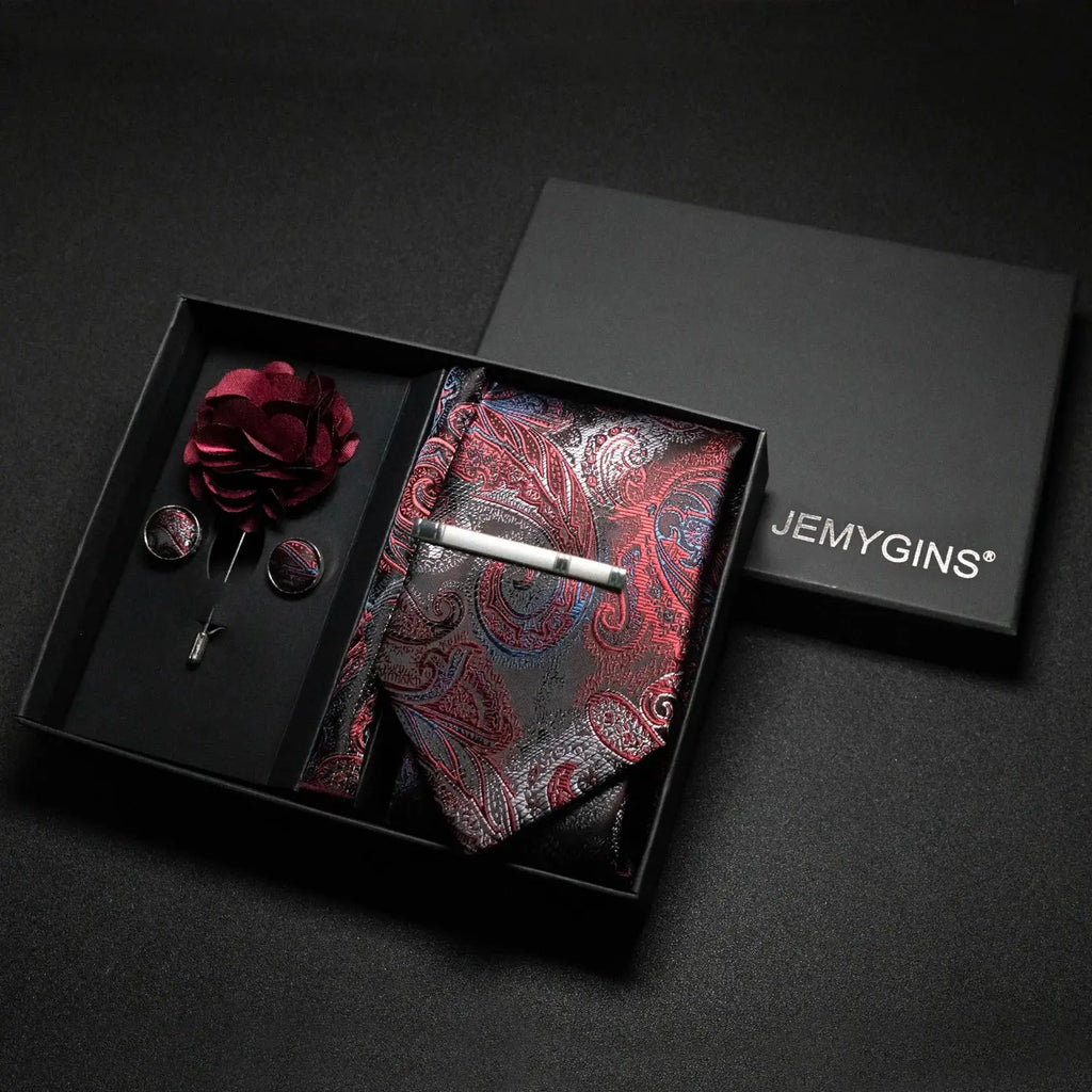 Wine-red paisley tie set with matching pocket square and cufflinks.