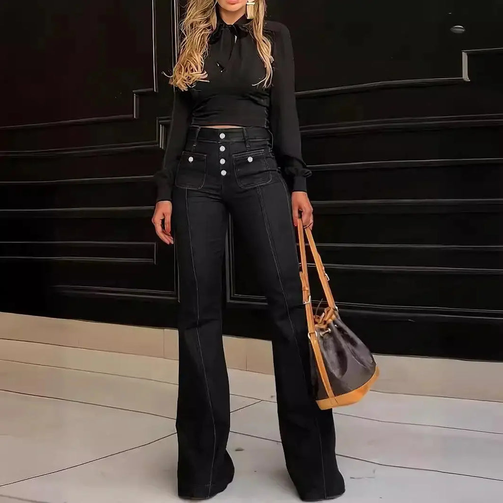 Flat lay of high-waist wide-leg jeans with accessories for a stylish outfit inspiration.