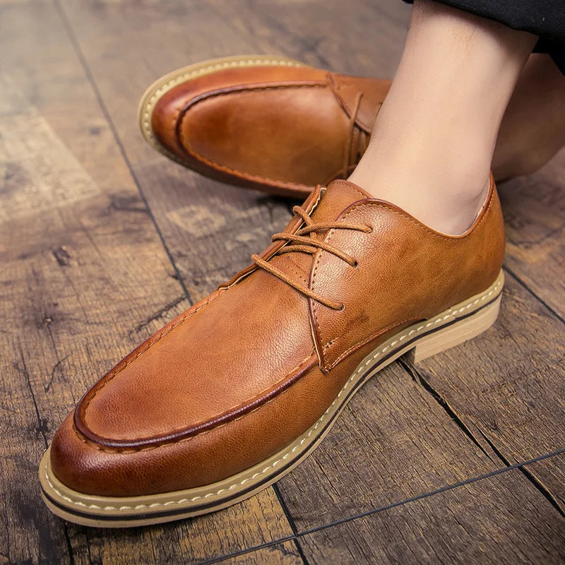 Close-up of leather derby shoe upper displaying supple texture and traditional lace-up closure