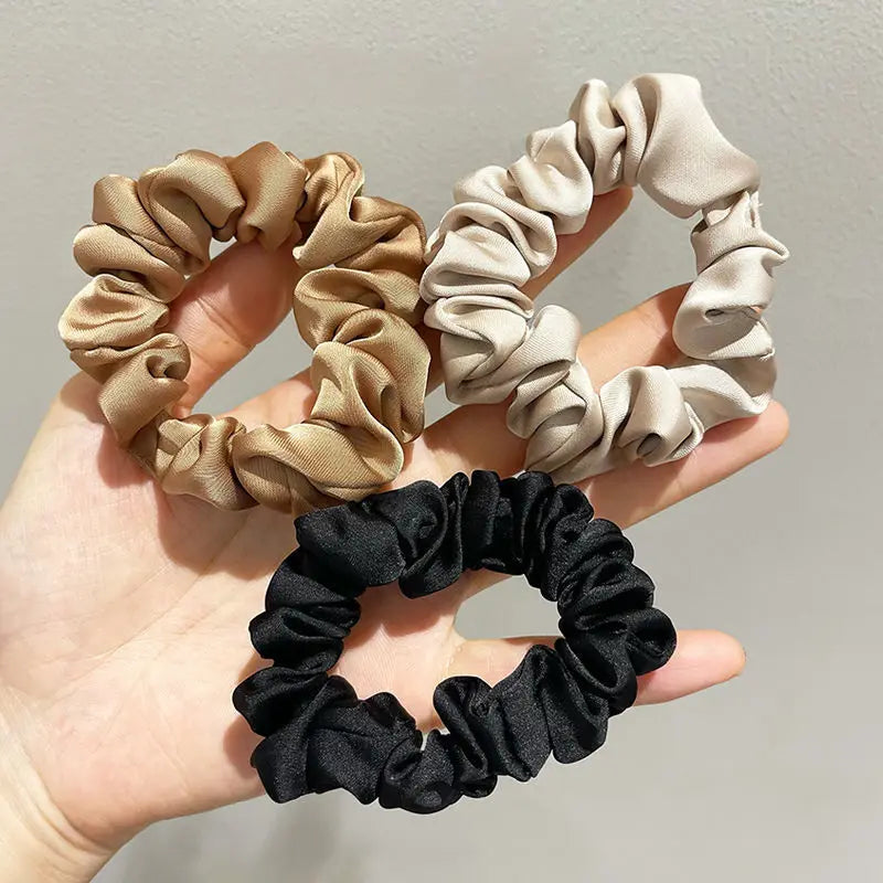 Premium silky scrunchies transitioning seamlessly from casual to evening looks