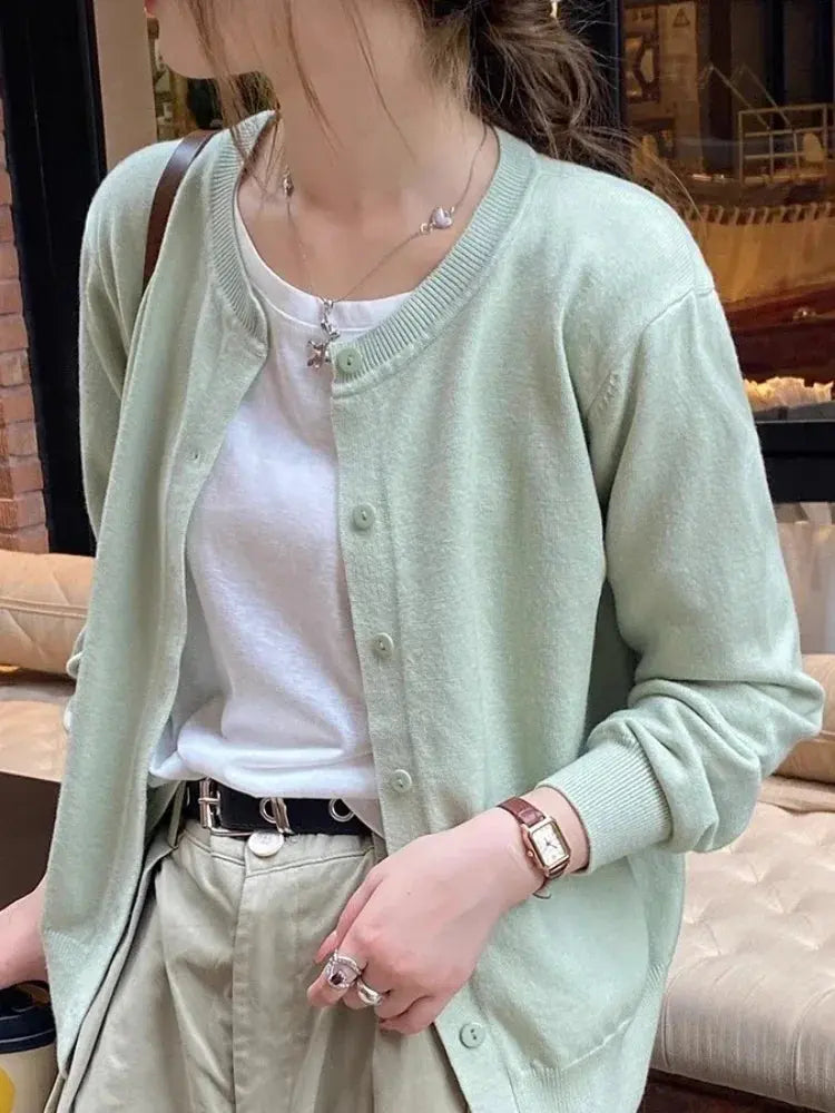 Back view of Cozy Chic Cardigan, emphasizing its sleek silhouette and lightweight nature.