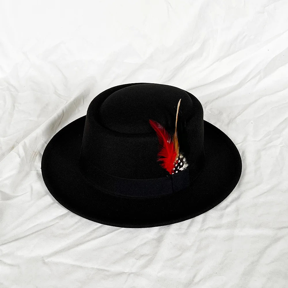 Black fedora styled with a casual outfit, illustrating its year-round versatility.