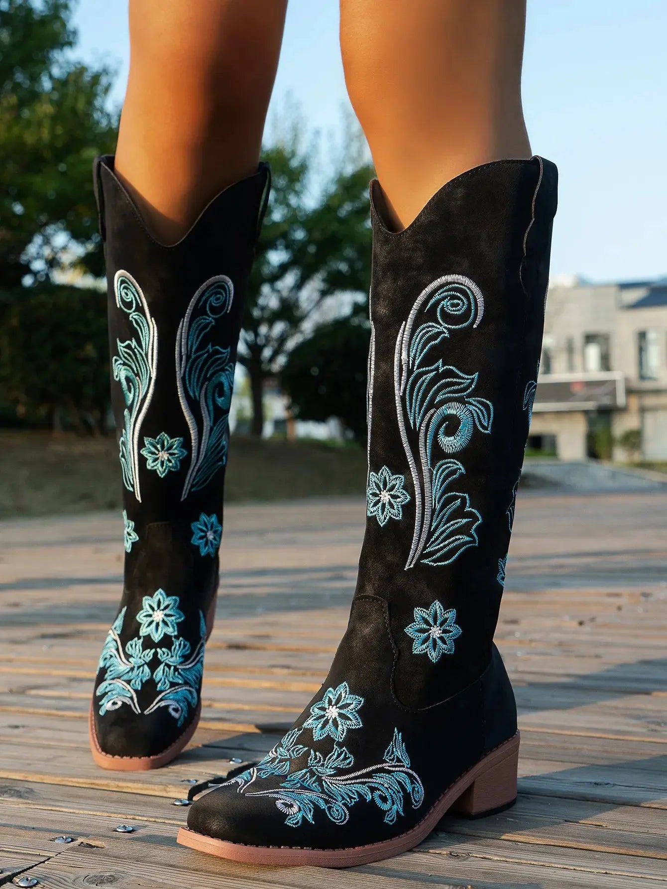 Mid-calf Western boots with detailed embroidery work and comfortable square heel design