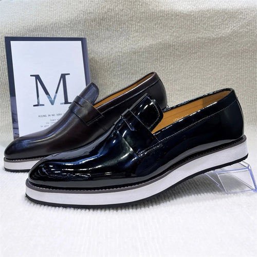 Black pointed toe leather loafers with sleek silhouette for professional business attire