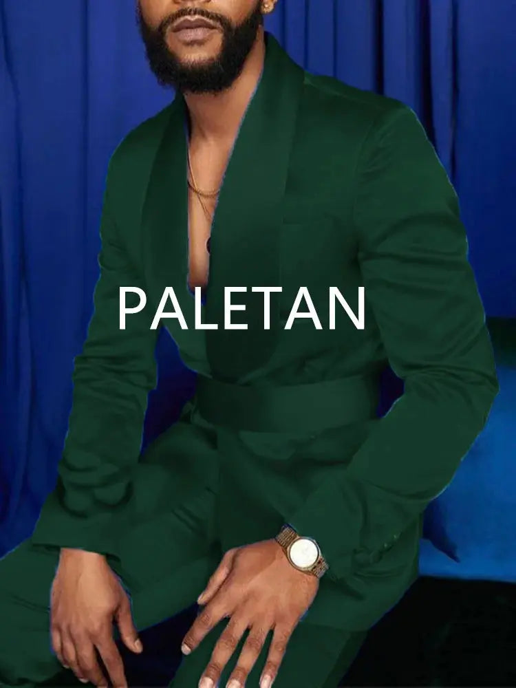 Model adjusting royal blue tuxedo jacket, demonstrating luxurious feel.