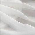 Elegant mermaid wedding dress featuring a sleek design and open back, perfect for outdoor ceremonies.