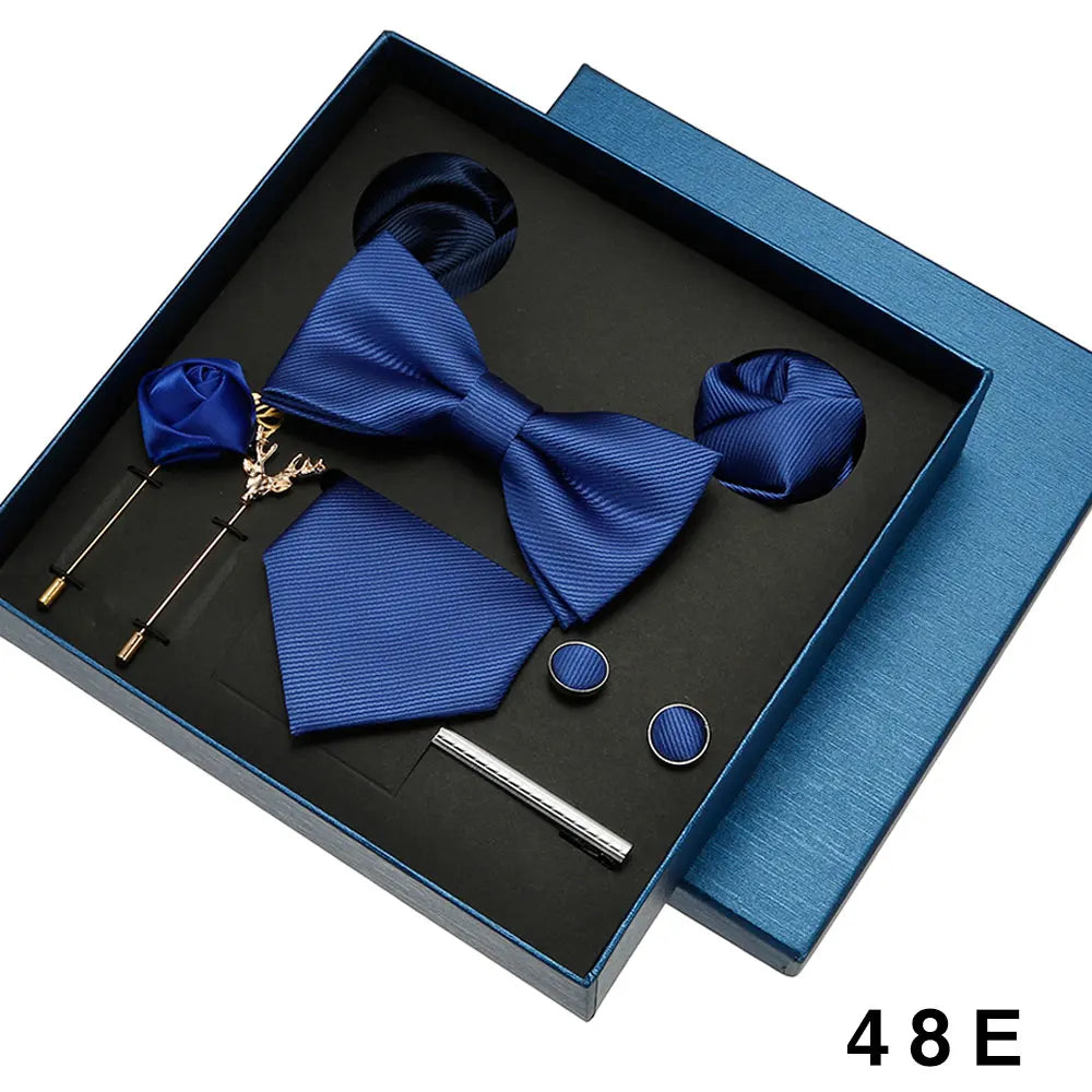 Elegant silk wedding tie set arranged in luxury gift box for groomsmen