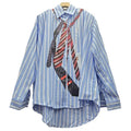 Back view of the tailored striped blouse, highlighting its structured design and elegant fit.