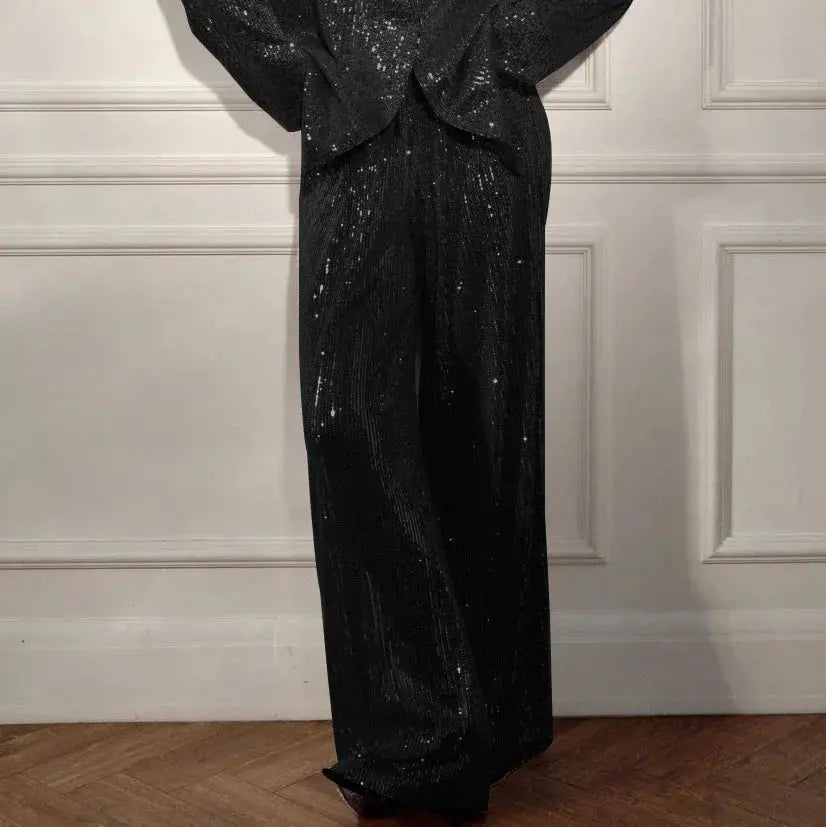 Model confidently walking in the Dazzle Effortlessly sequin suit set, commanding attention.