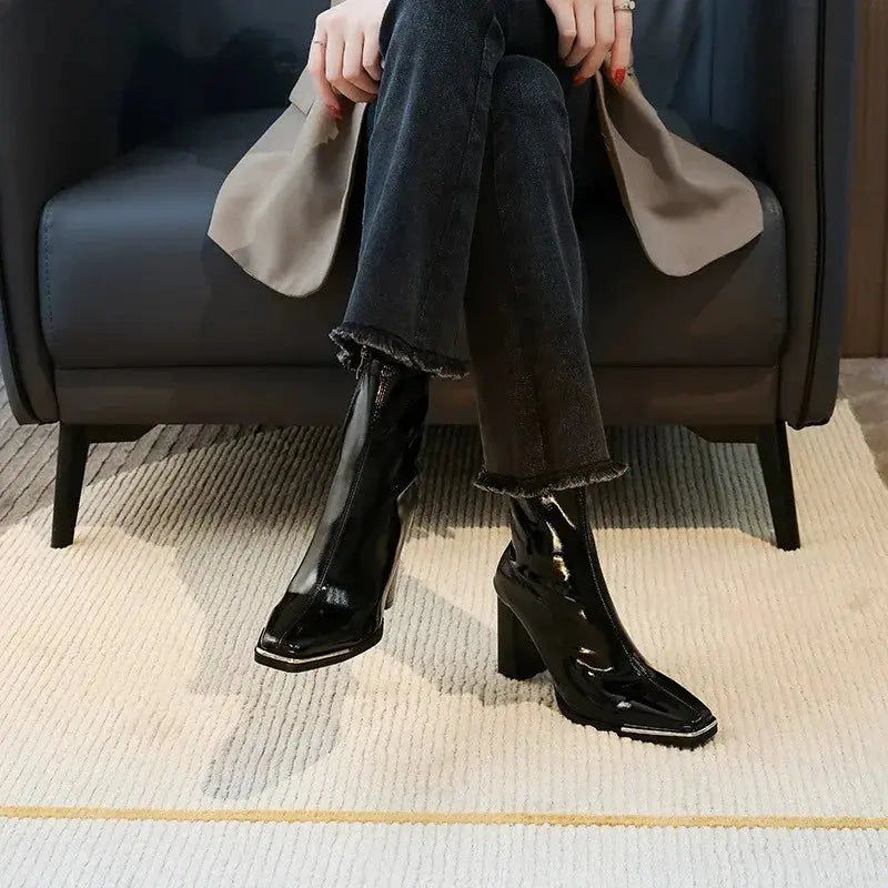 Close-up of pointed toe design on Midnight Whisper Boots showcasing sleek silhouette.