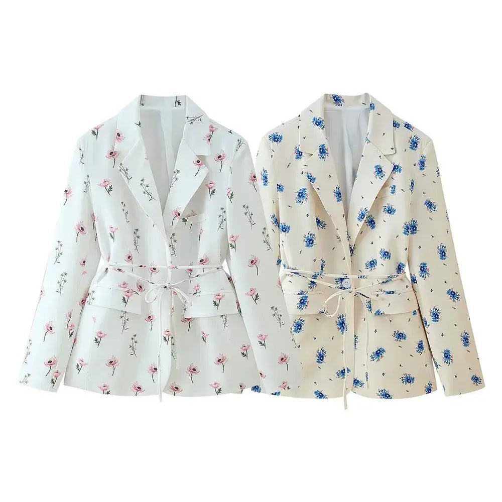 Close-up of the Floral Whisper Belted Jacket showcasing the vibrant floral print and single-button closure.