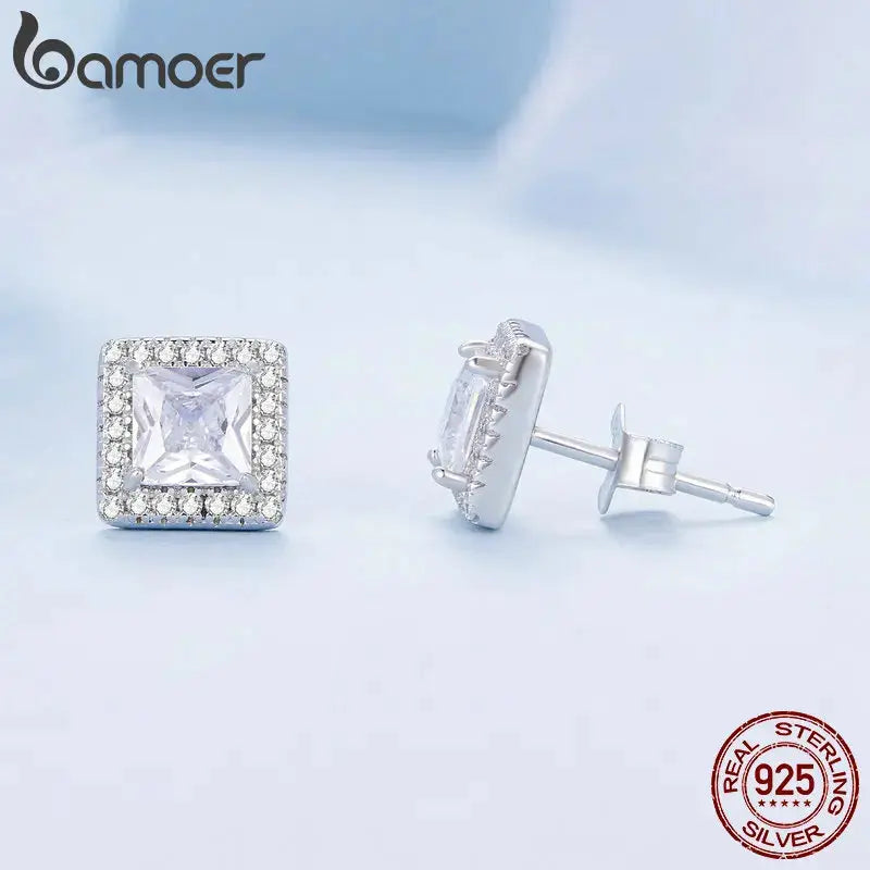 Close-up of Radiant Halo Studs highlighting the square halo setting and zirconia stone's brilliance.