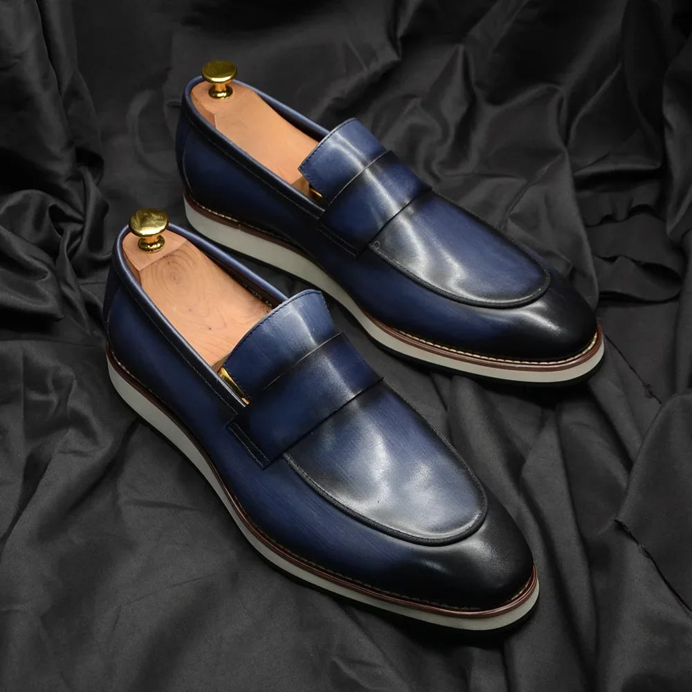 Professional boardroom penny loafers in refined blue leather with traditional silhouette