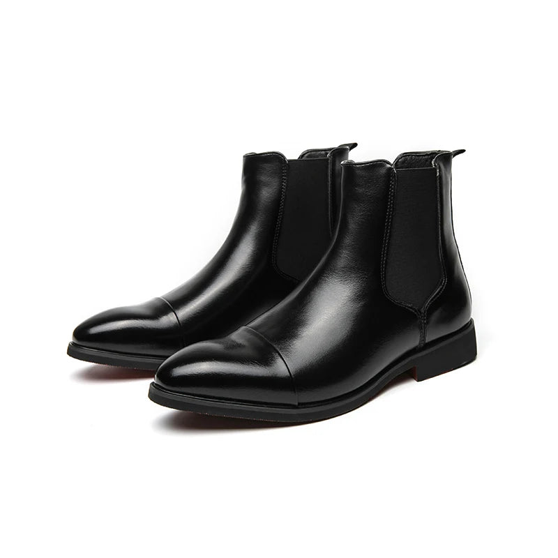 Business casual Chelsea boots with bold red sole paired with tailored trousers for office wear