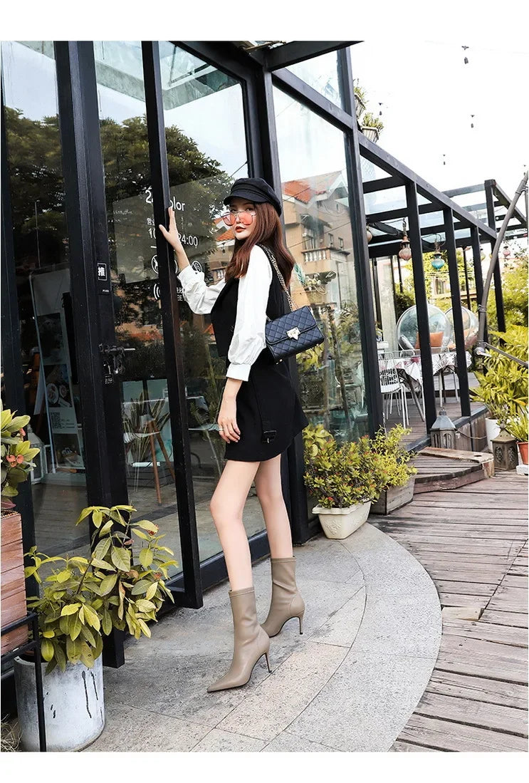 Modern mid-calf leather boots with thin heel and polished finish