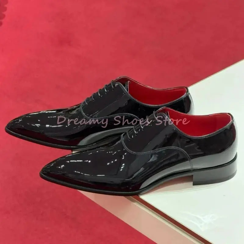 Sleek black patent leather Oxfords with sharp silhouette for formal occasions.