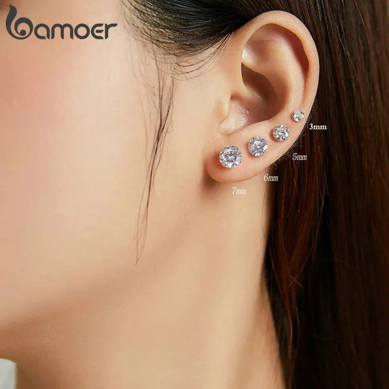 Platinum-plated sterling silver stud earrings with cubic zirconia for subtle sparkle.