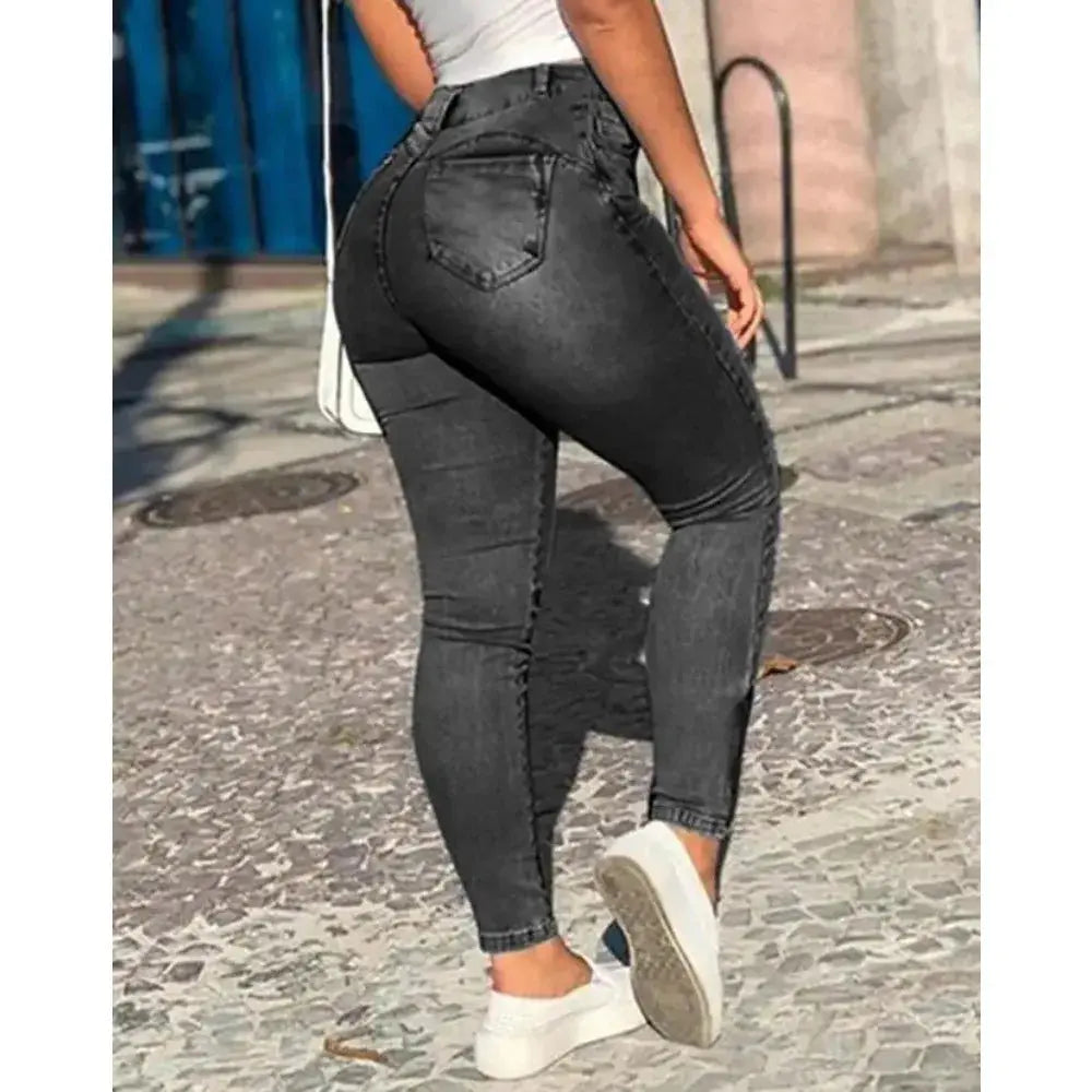Model wearing high-waist jeans, showcasing a flattering silhouette and confident stride.