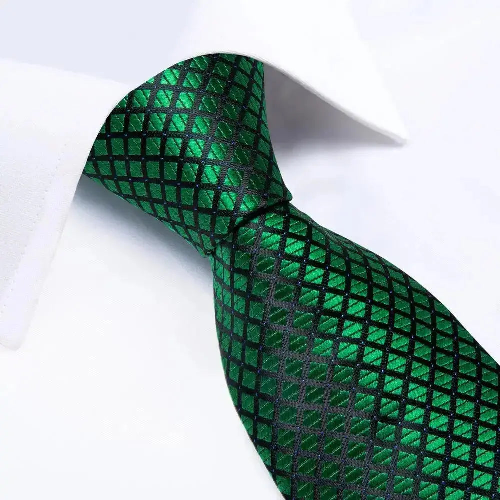 Elegant cufflinks complementing the silk tie and handkerchief.