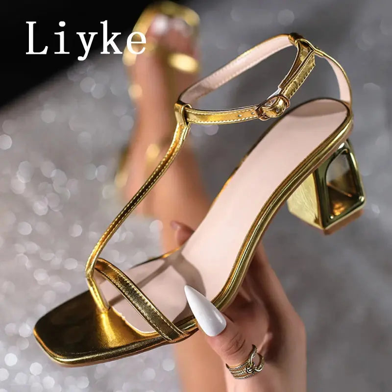 Stylish gold sandals with a modern square toe and delicate band for evening wear.