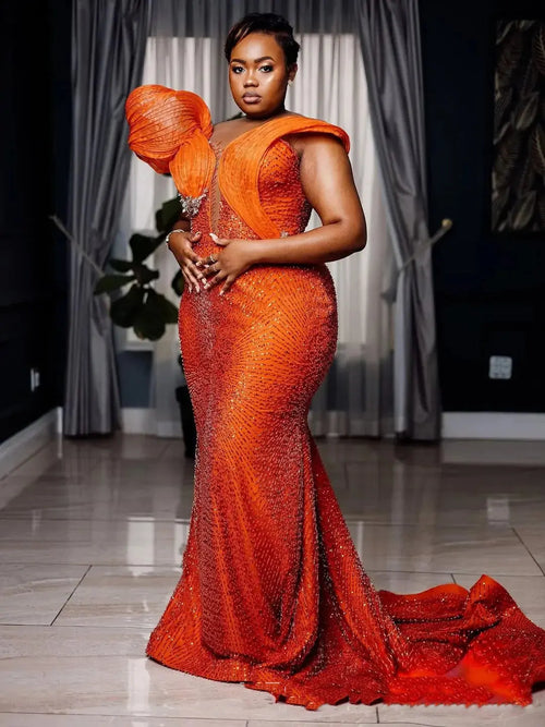 Elegant pleated shoulder detail of the Sunlit Glow Mermaid Gown showcasing a regal silhouette.