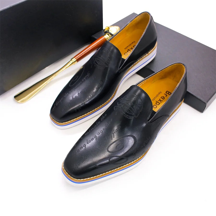 Handcrafted black leather loafers showing full grain construction and intricate laser-cut detailing