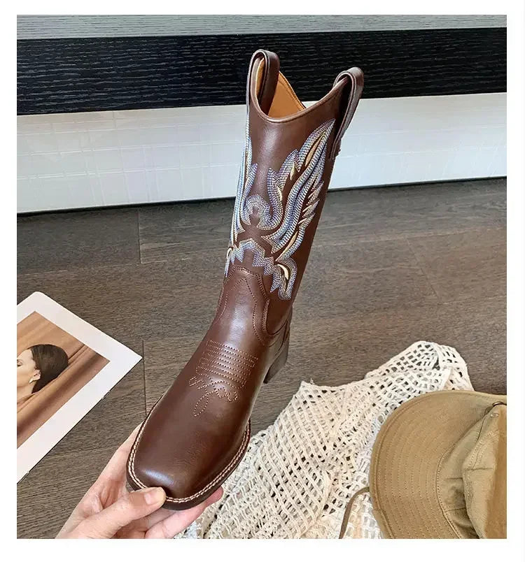 Brown leather cowboy boots featuring embroidered shaft and cushioned PU insole