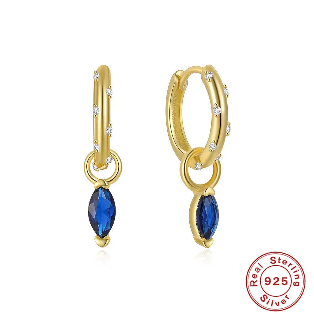 Geometric silver earrings adorned with sparkling zircon crystals.