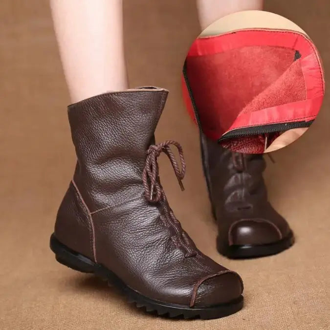 Black leather winter boots with a sleek silhouette, combining style and warmth.