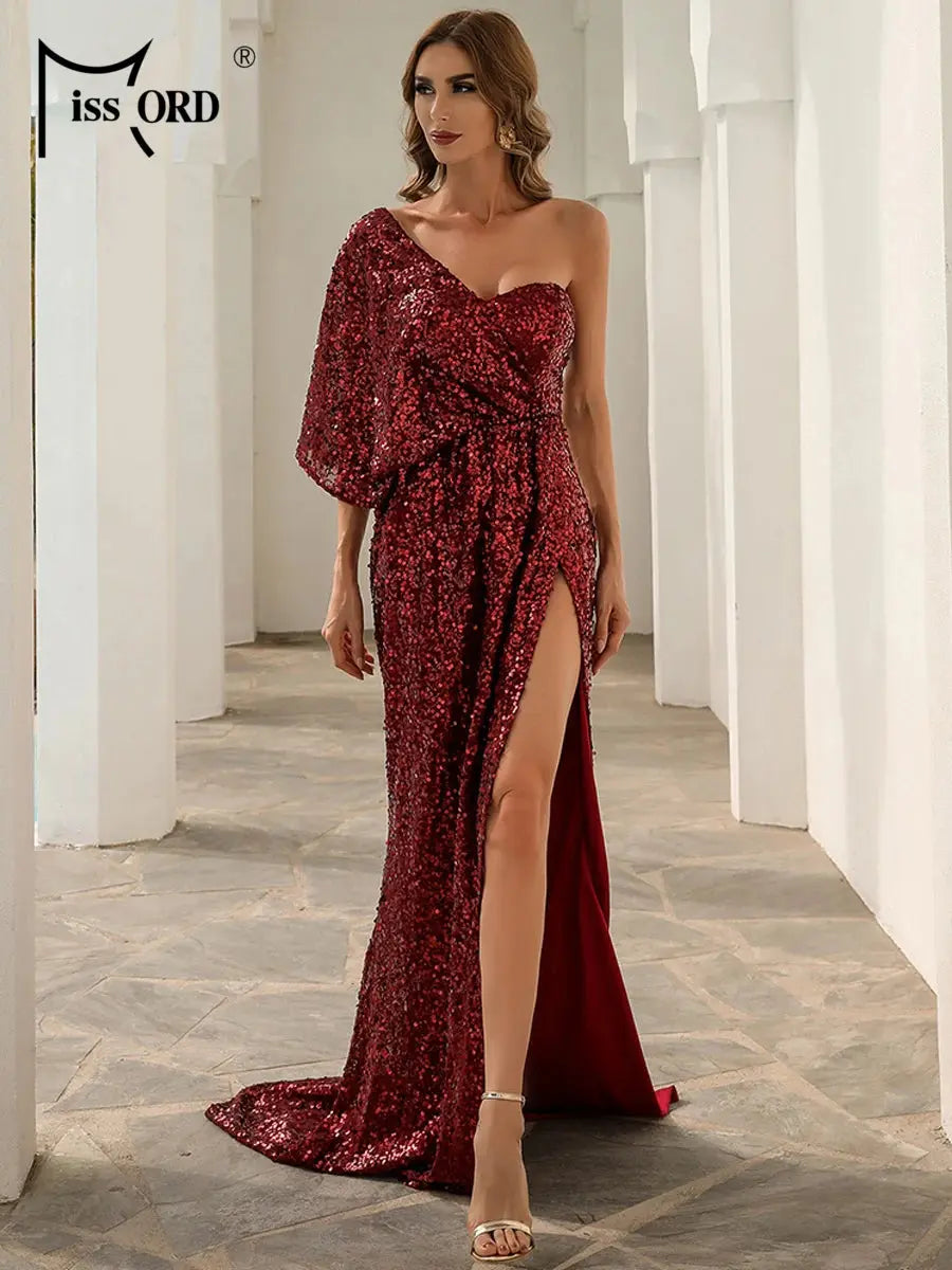 Thigh-high split detail of the gown, adding a bold touch to the elegant design.