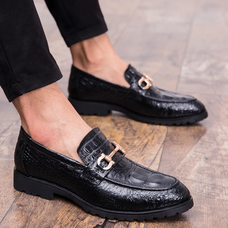 Close-up of croc-embossed loafers showcasing the luxurious split leather.