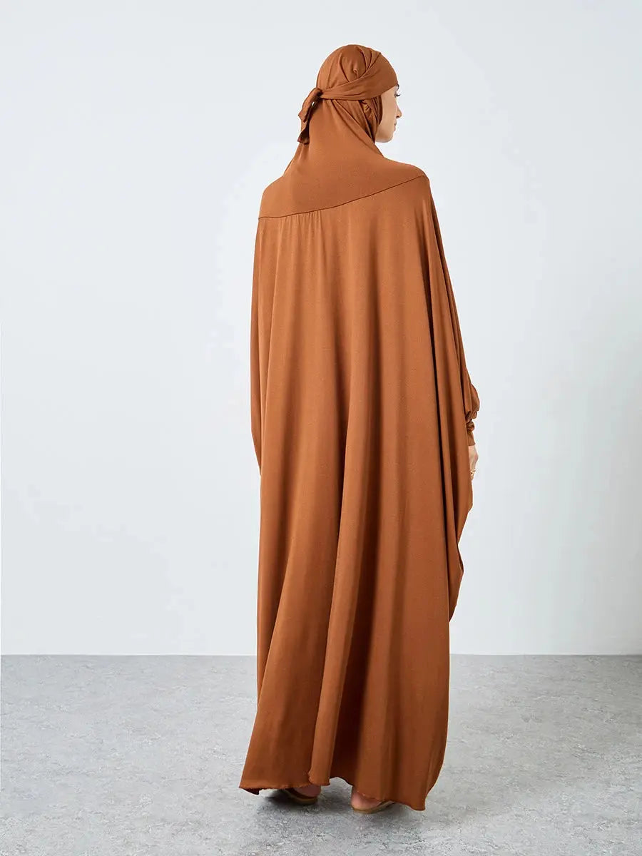 Serene Grace Abaya showcasing modest style for spiritual journeys.